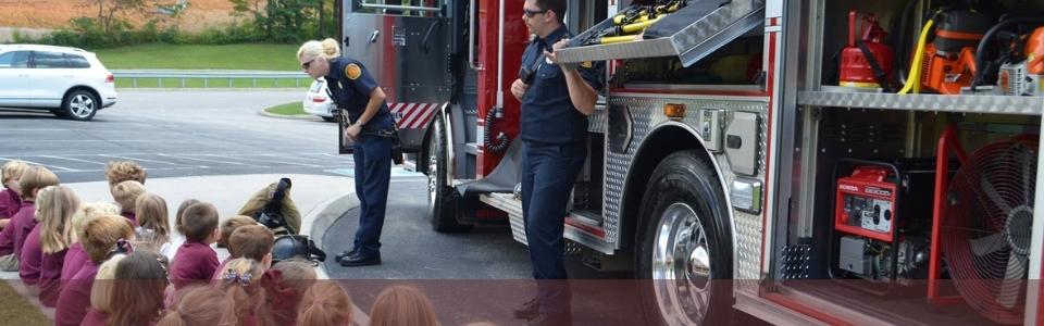firefighters with students